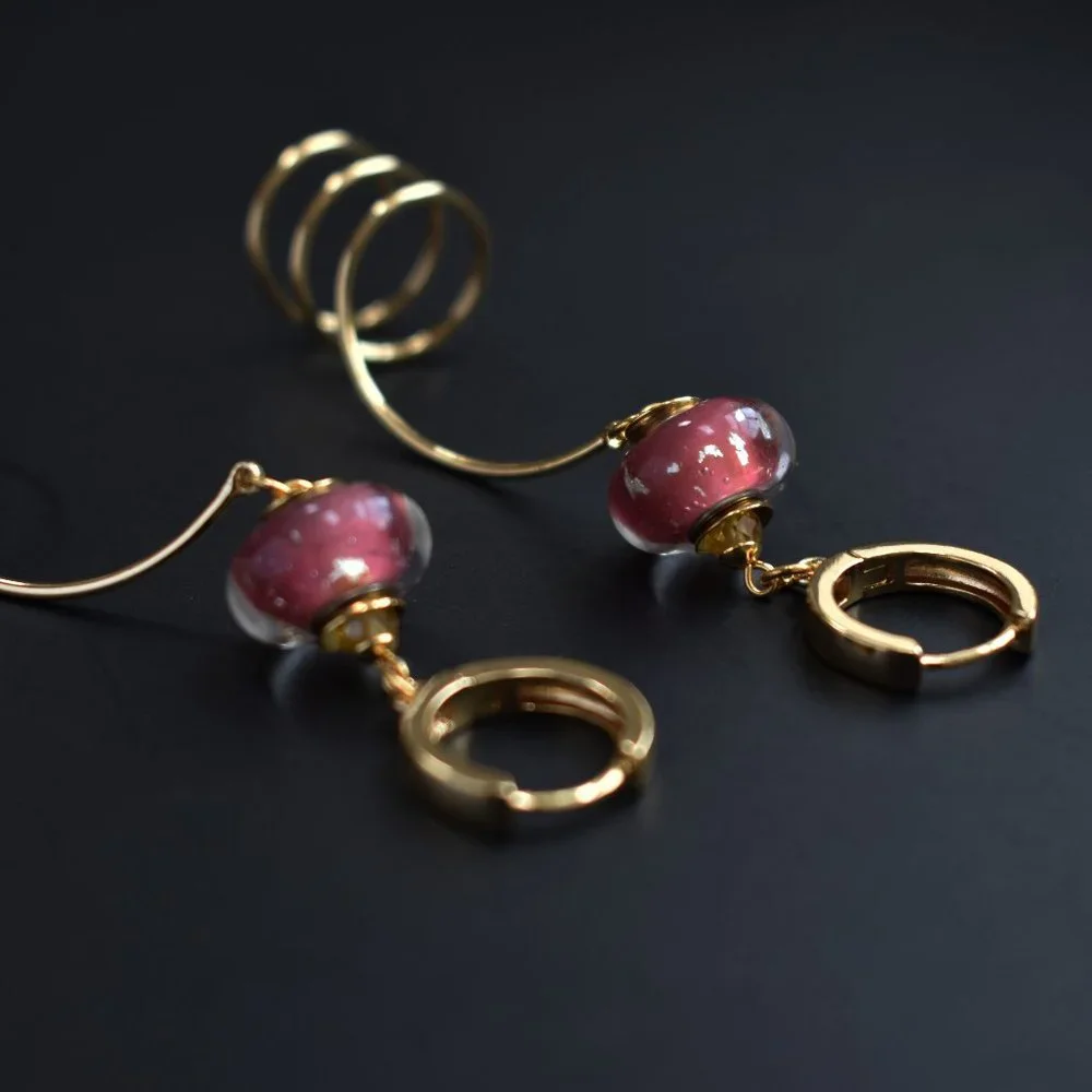 Unmatched earrings dangle, large spiral earrings gold tone